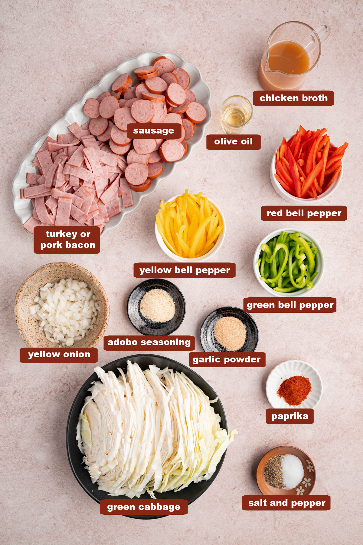 All of the ingredients for southern fried cabbage in bowls on a countertop.