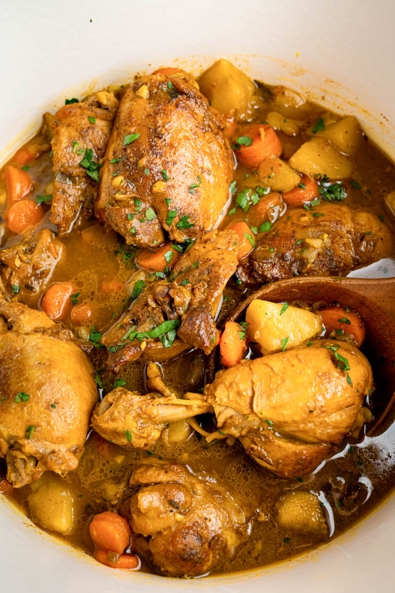 Jamaican Chicken Curry in a pan on the stove after cooking.