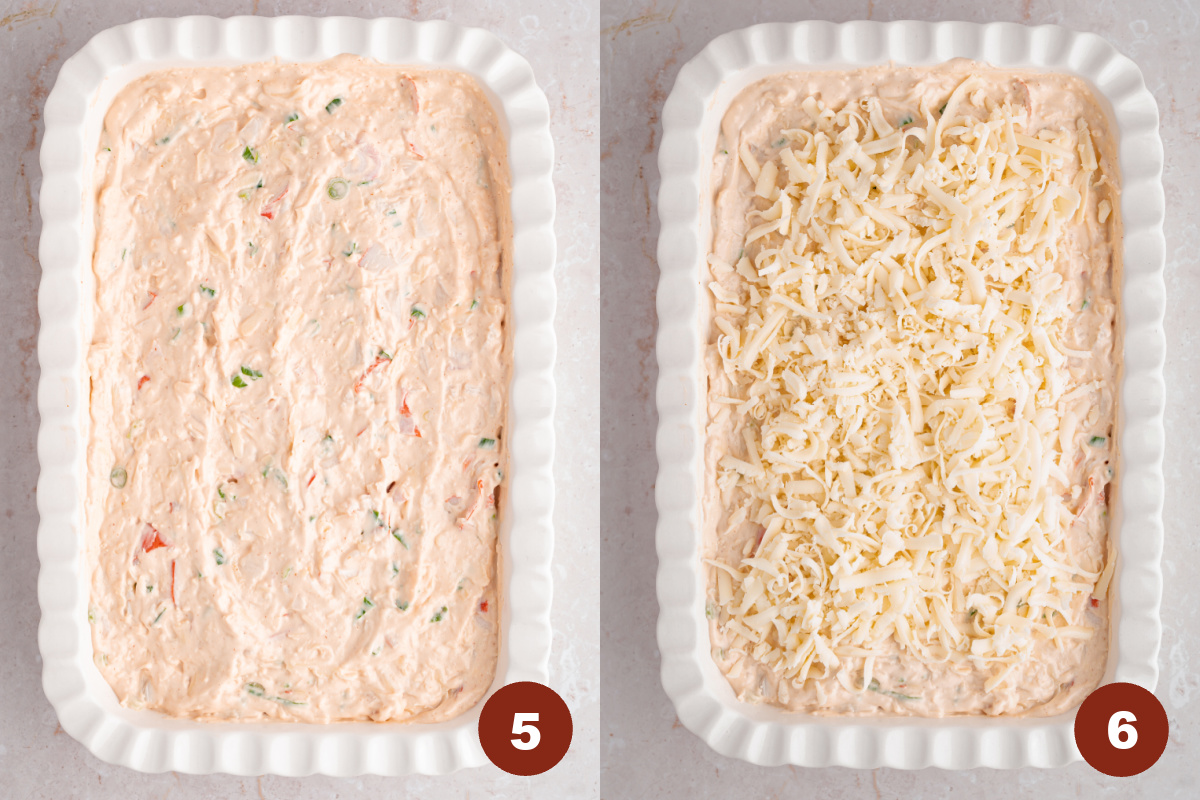 The crab dip layered in the baking dish with a sprinkle of cheese on top before baking in the oven.