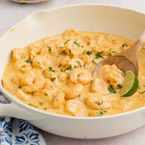 Camarones al ajillo in a skillet after cooking.