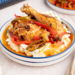 Italian dressing chicken on a plate with mashed potatoes for serving.