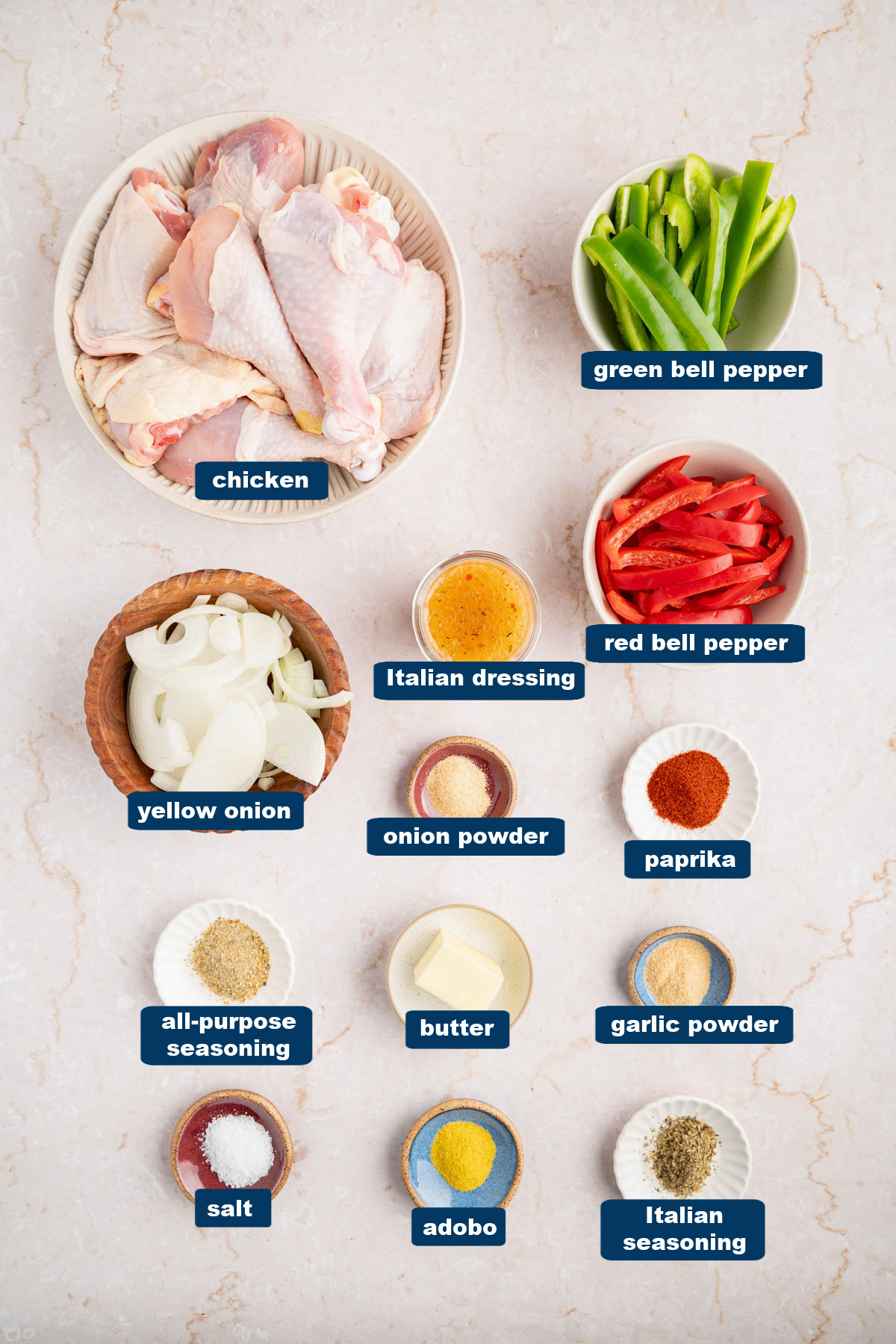 All of the ingredients for Italian dressing chicken in bowls on a countertop.
