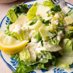 Classic caesar salad on a plate for serving.