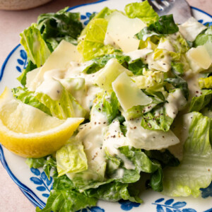 Classic caesar salad on a plate for serving.