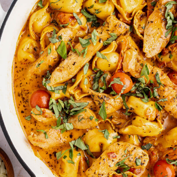 Creamy chicken tortellini in a skillet after cooking.