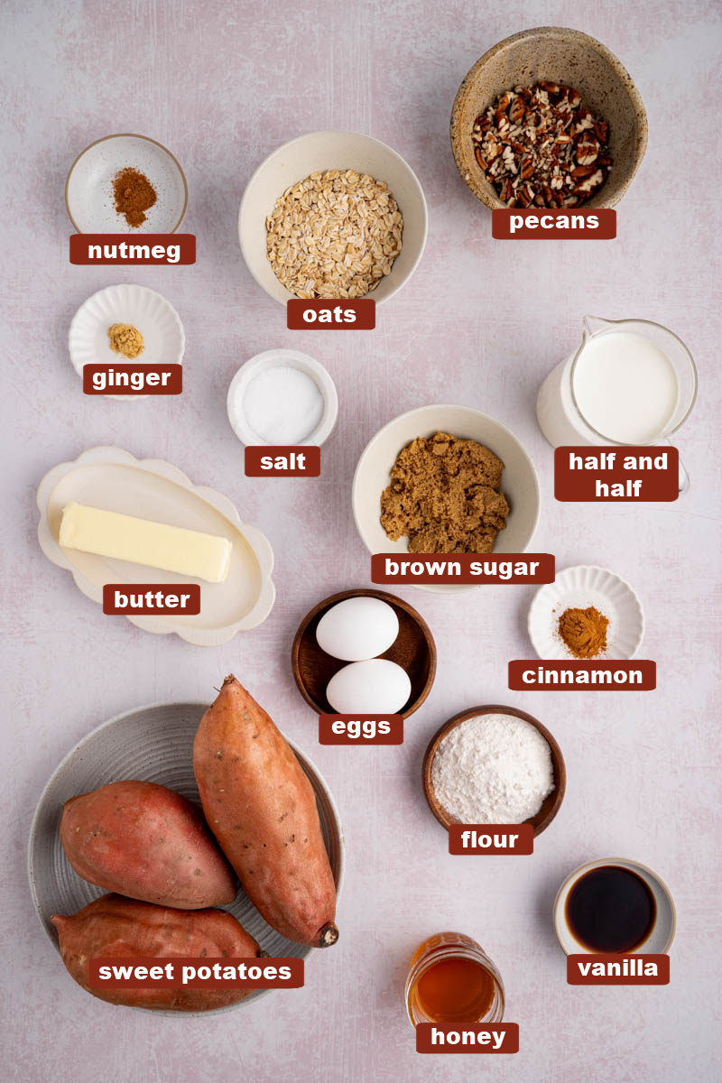 All of the ingredients for sweet potato casserole in bowls on a countertop.