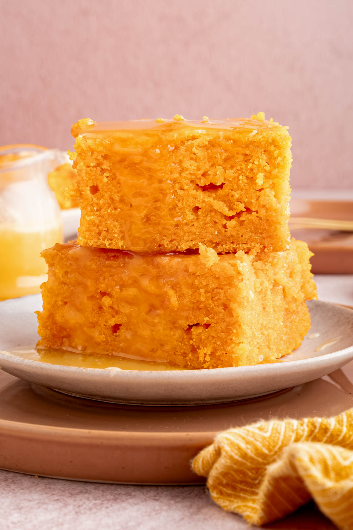Two pieces of sweet potato cornbread stacked on a plate.