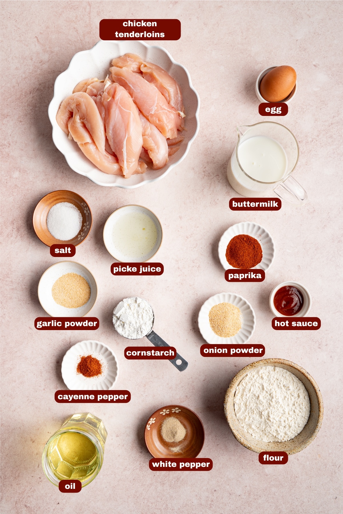 Ingredients for Copycat Canes Chicken Tenders seen on a table in small bowls