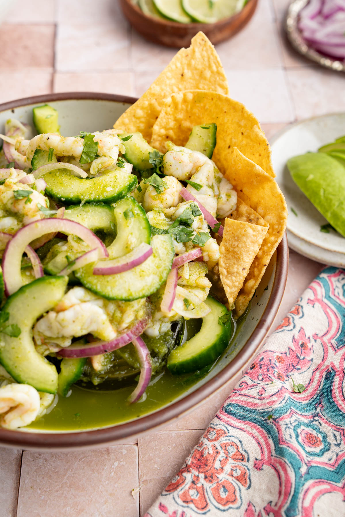 The aguachile in a bowl with a few tortilla chips for serving.