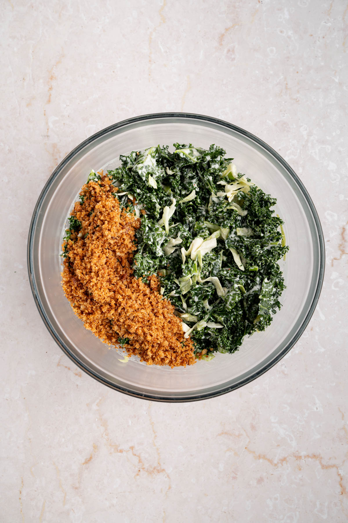 The dressed salad with the breadcrumbs on top.