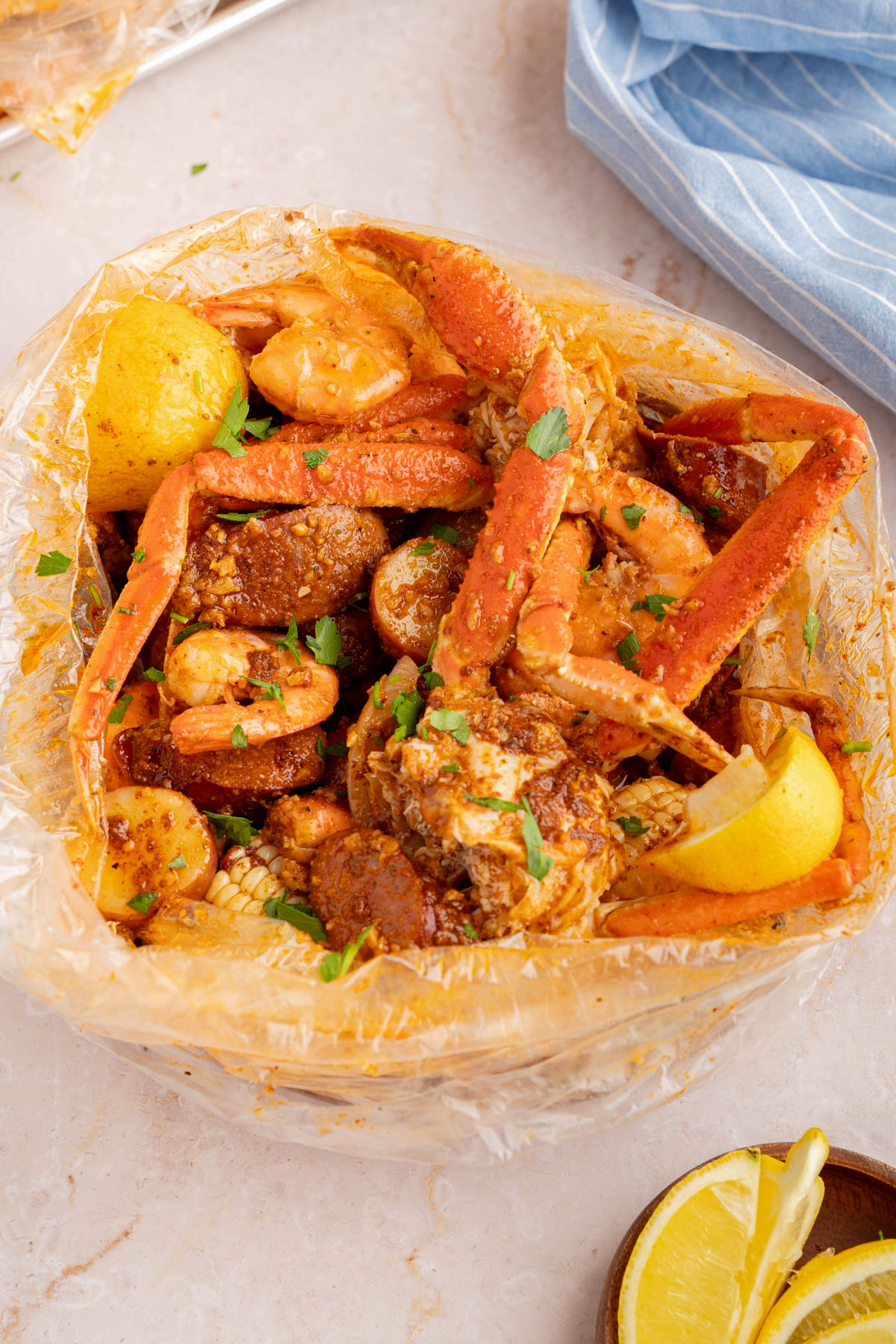 The seafood boil in a bag on a countertop for serving.