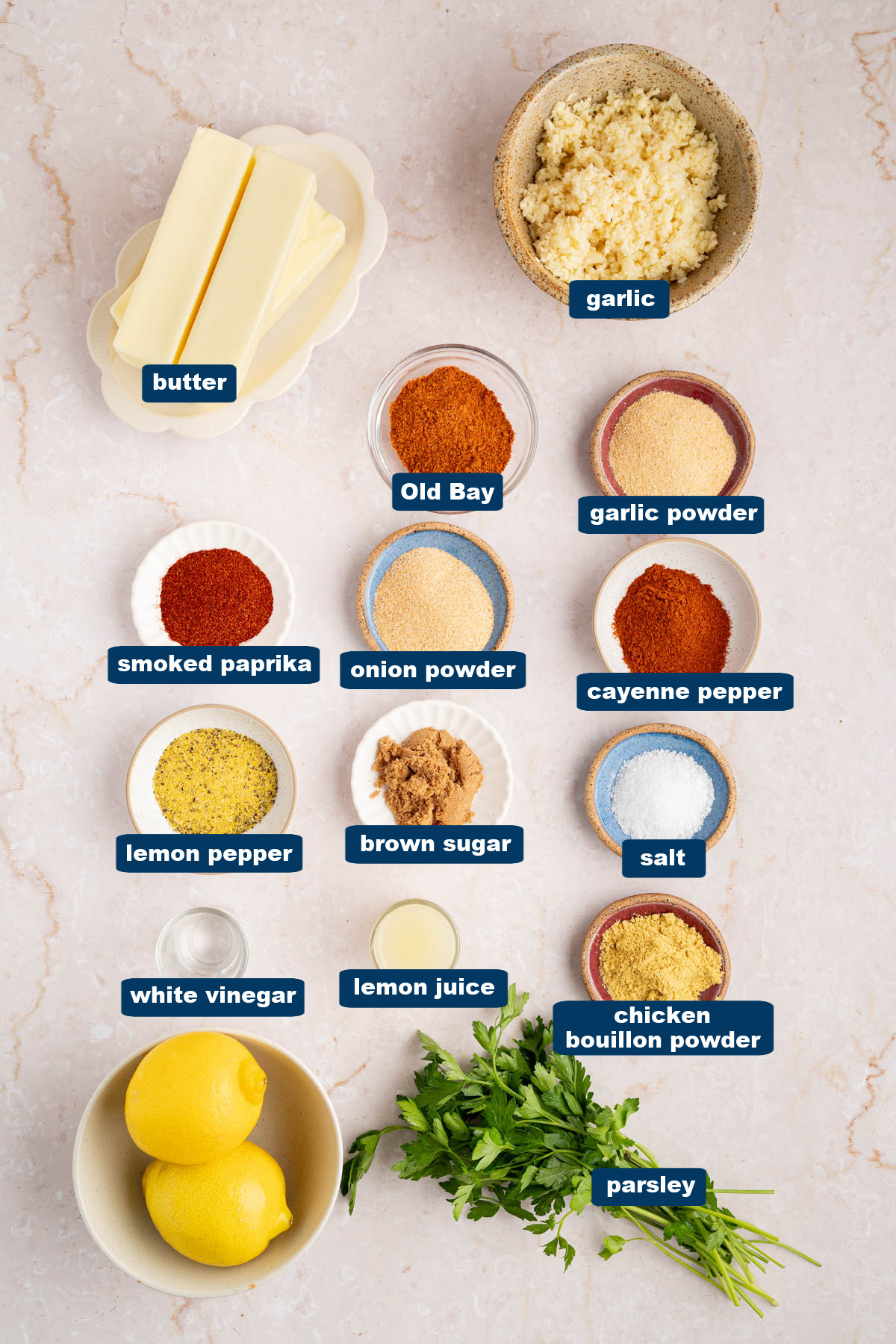 The ingredients for the sauce in bowls on a countertop.