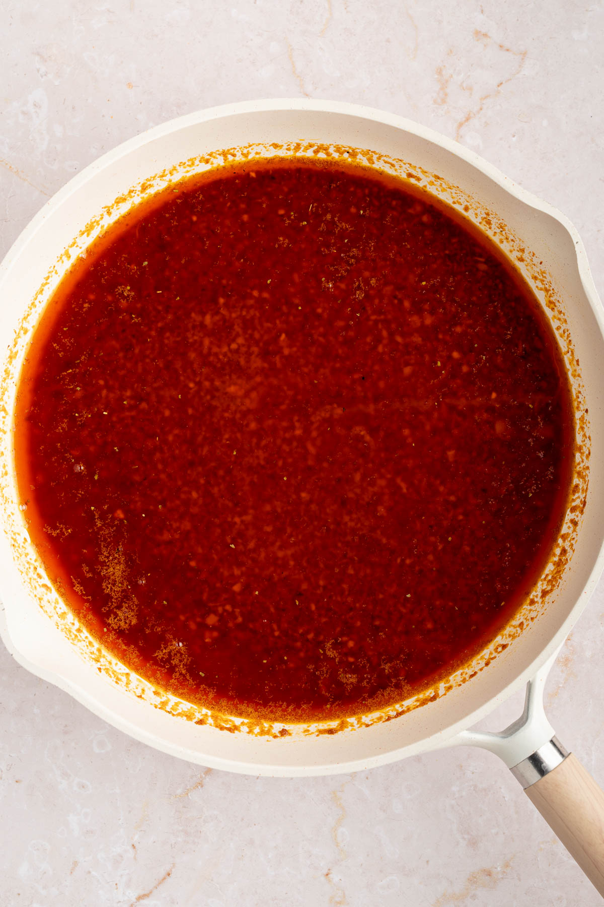 The sauce in the pan after adding the lemon juice and vinegar.