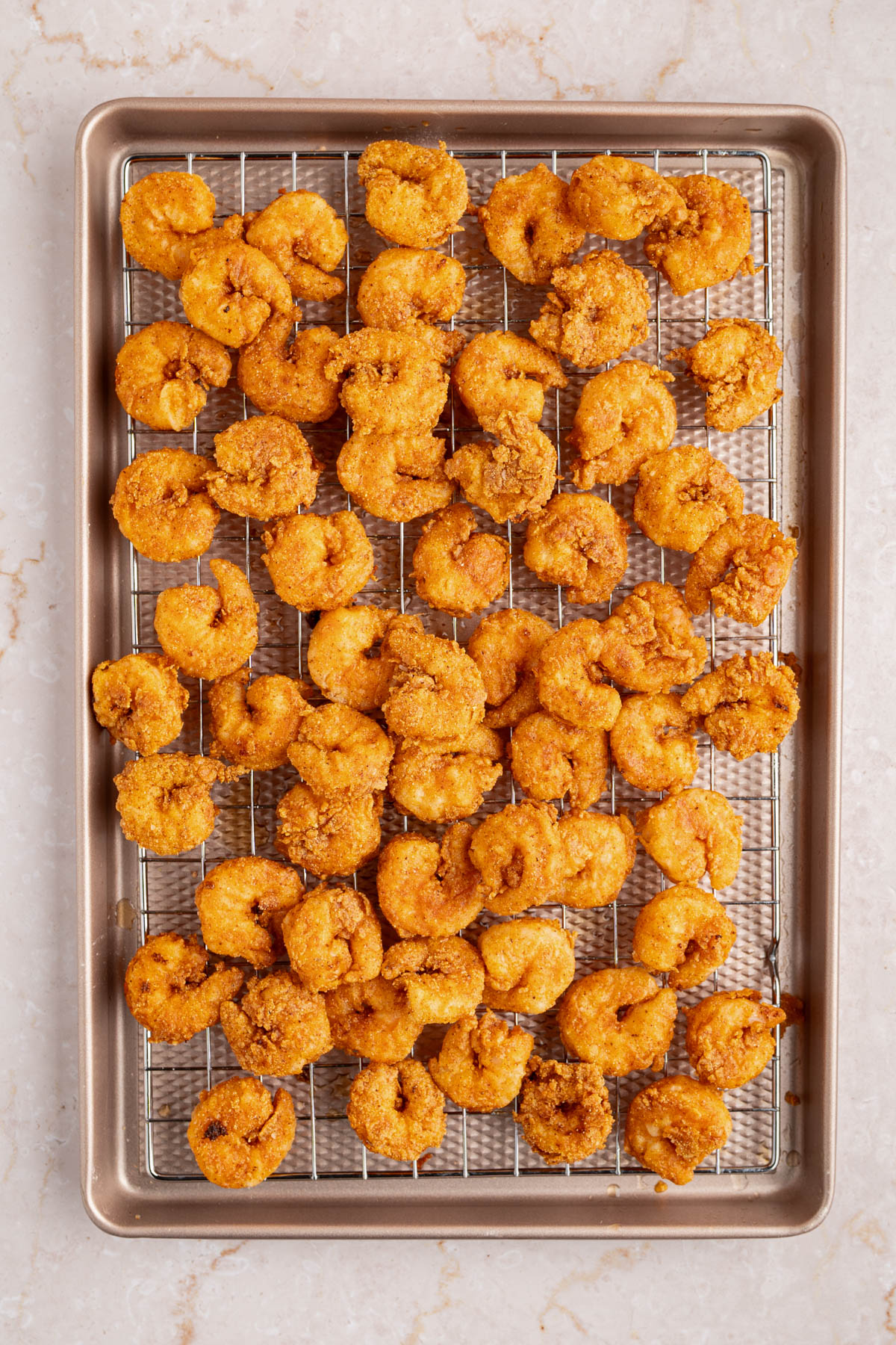 The shrimp frying in the preheated oil.