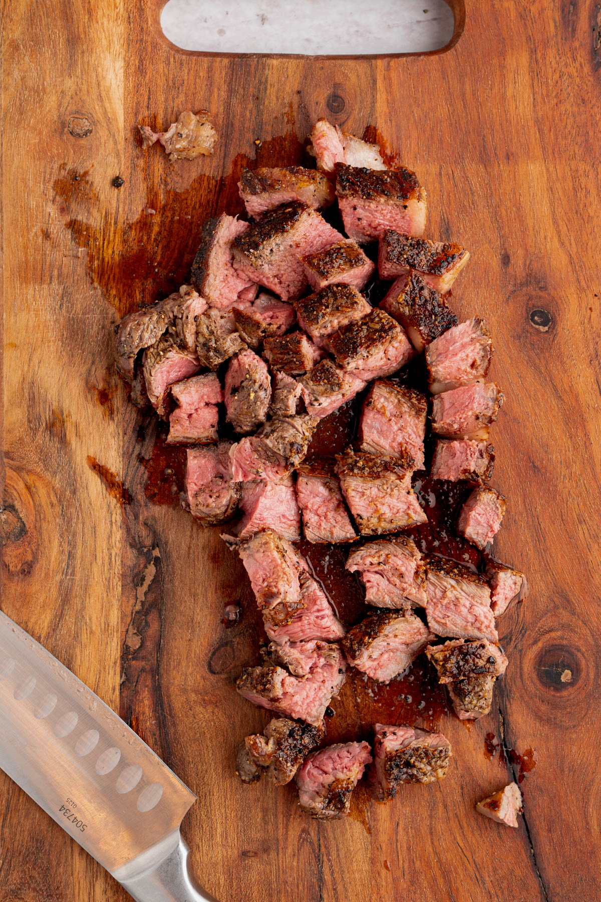 The steak cut into cubes after cooking and resting.