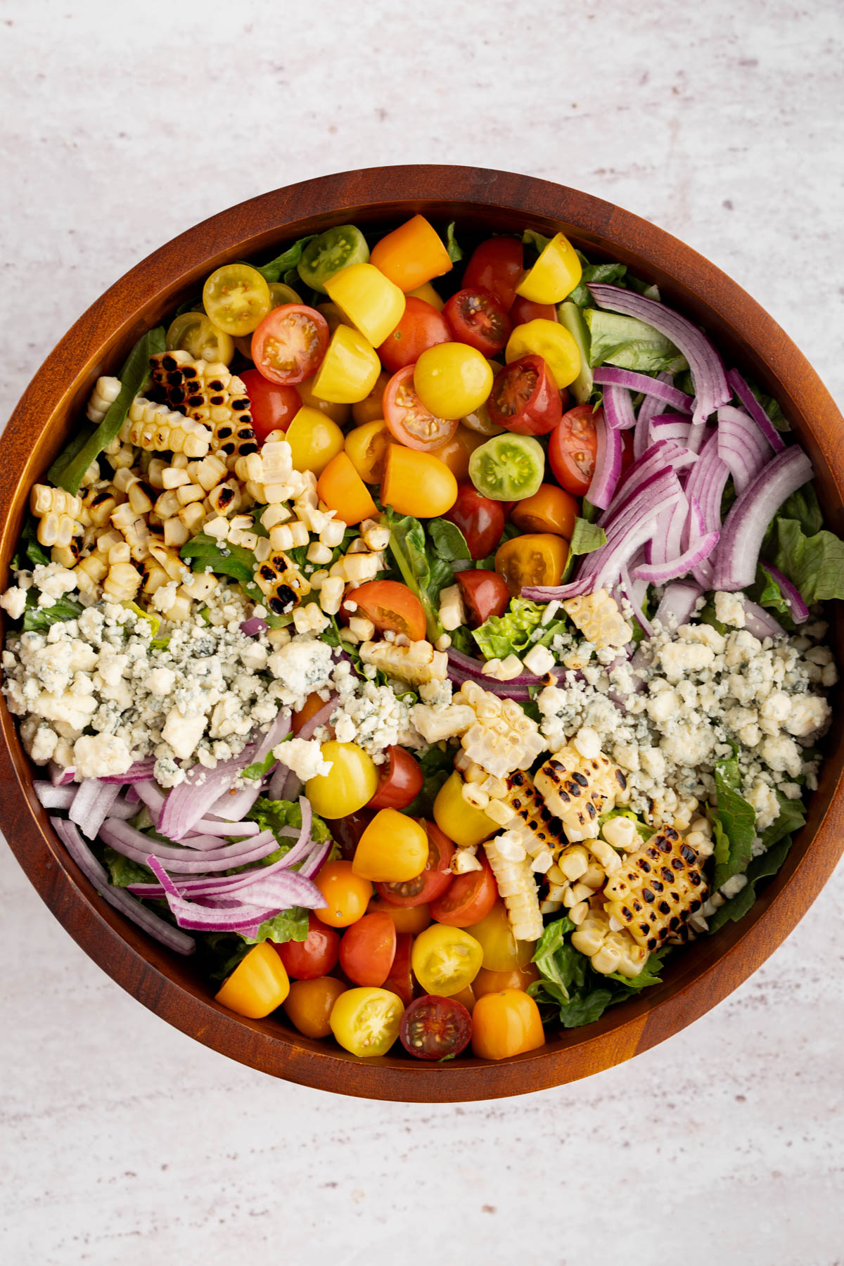 The salad assembled in the bowl before adding the steak on top.