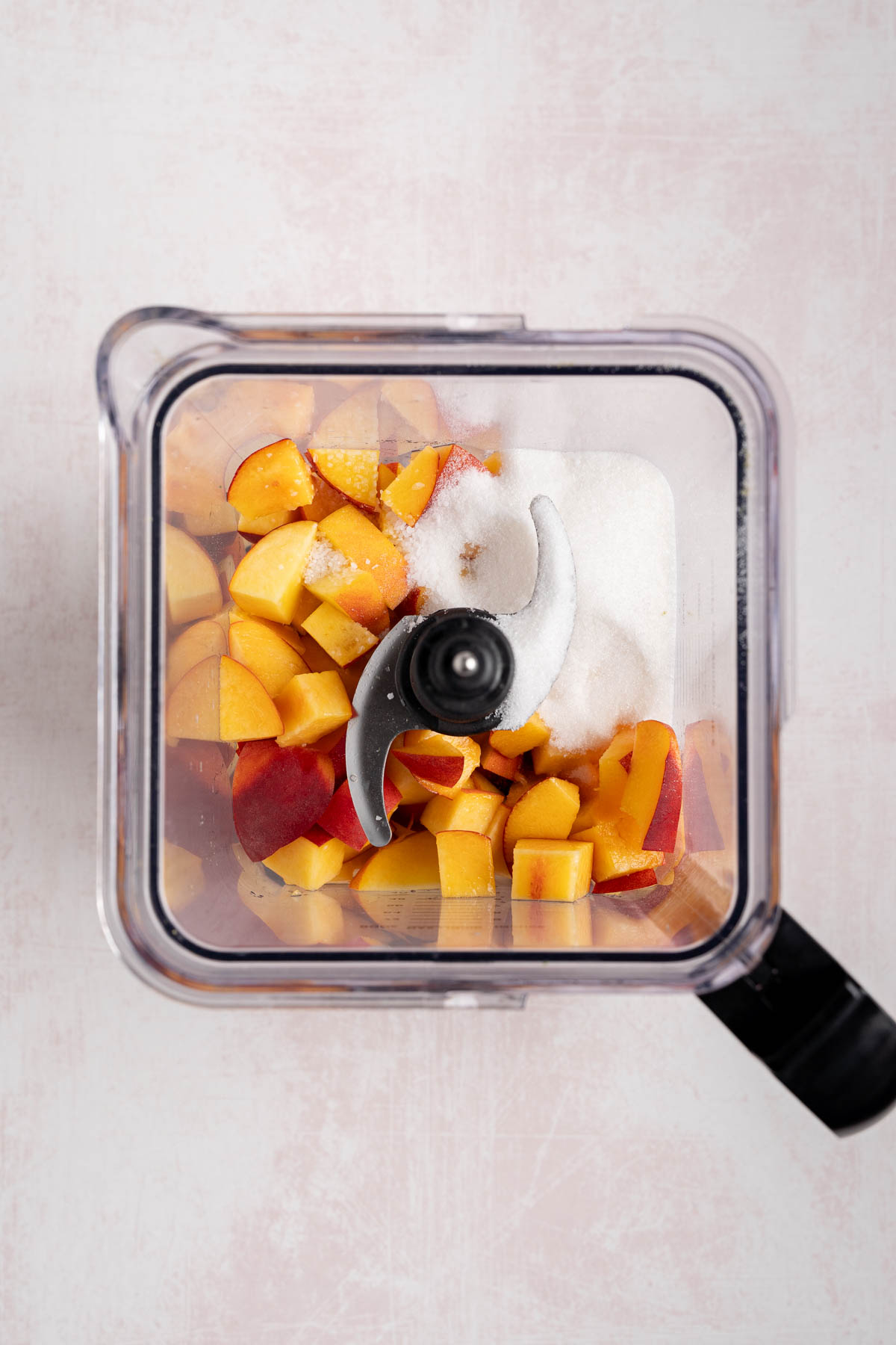 All of the ingredients for the peach lemonade in the blender before blending.