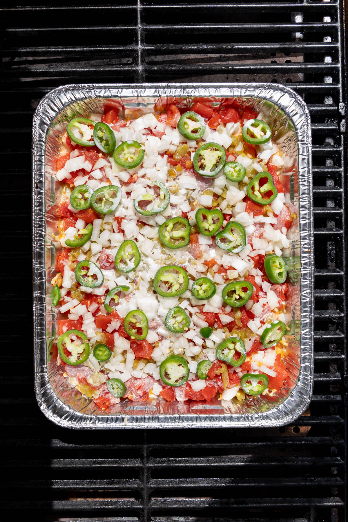 The rotel dip on the grill before the cheese is melted.