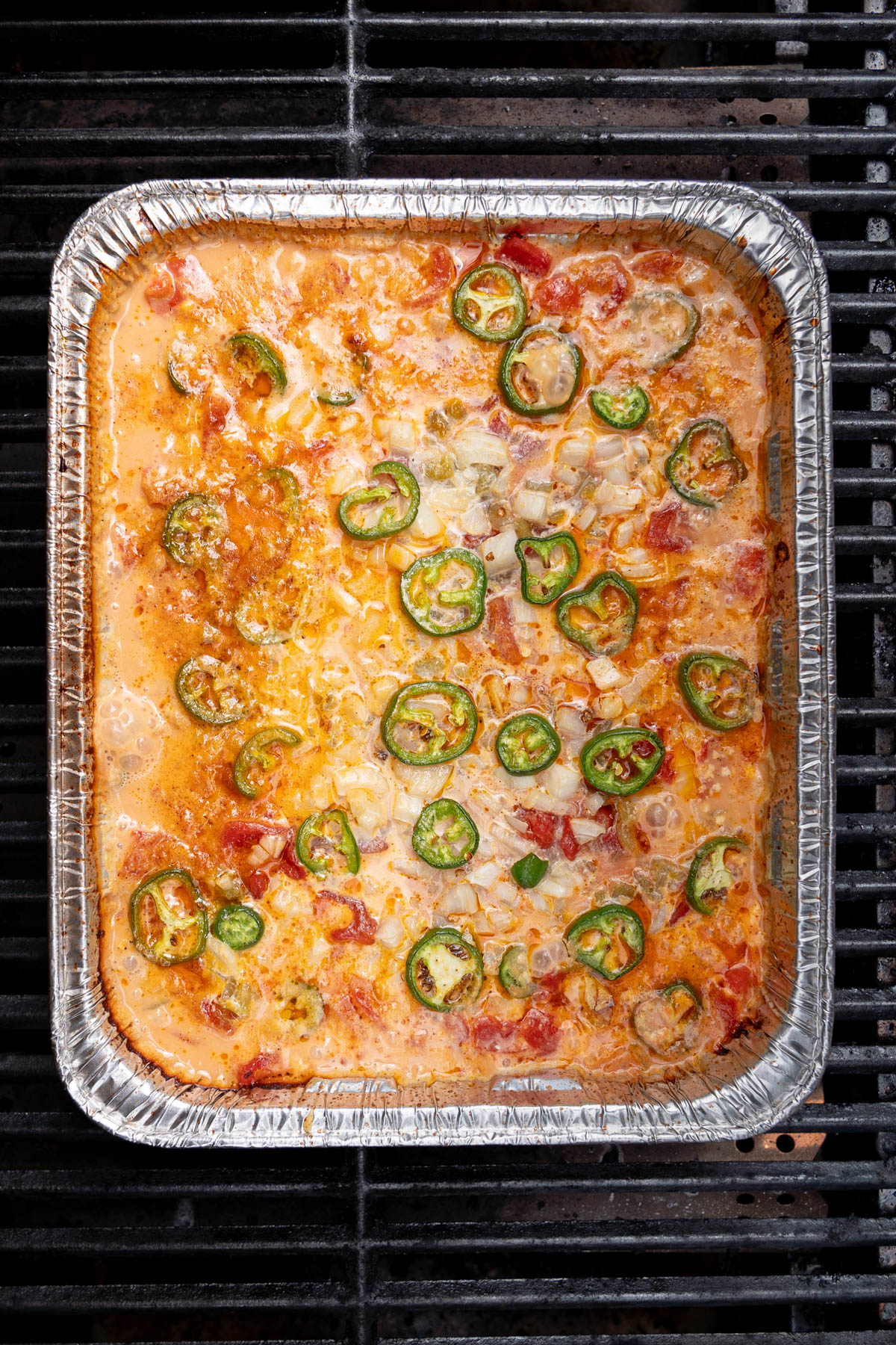 The rotel dip on the grill after cooking and before stiring.