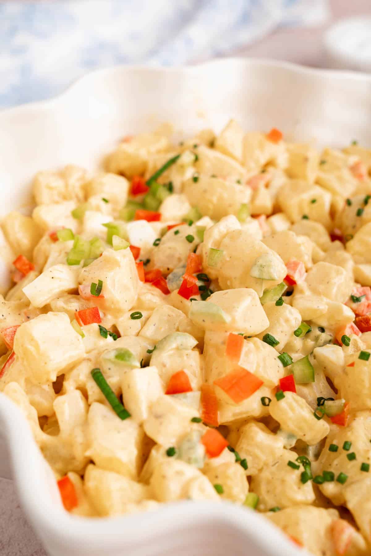 Puerto rican potato salad in a white serving dish.