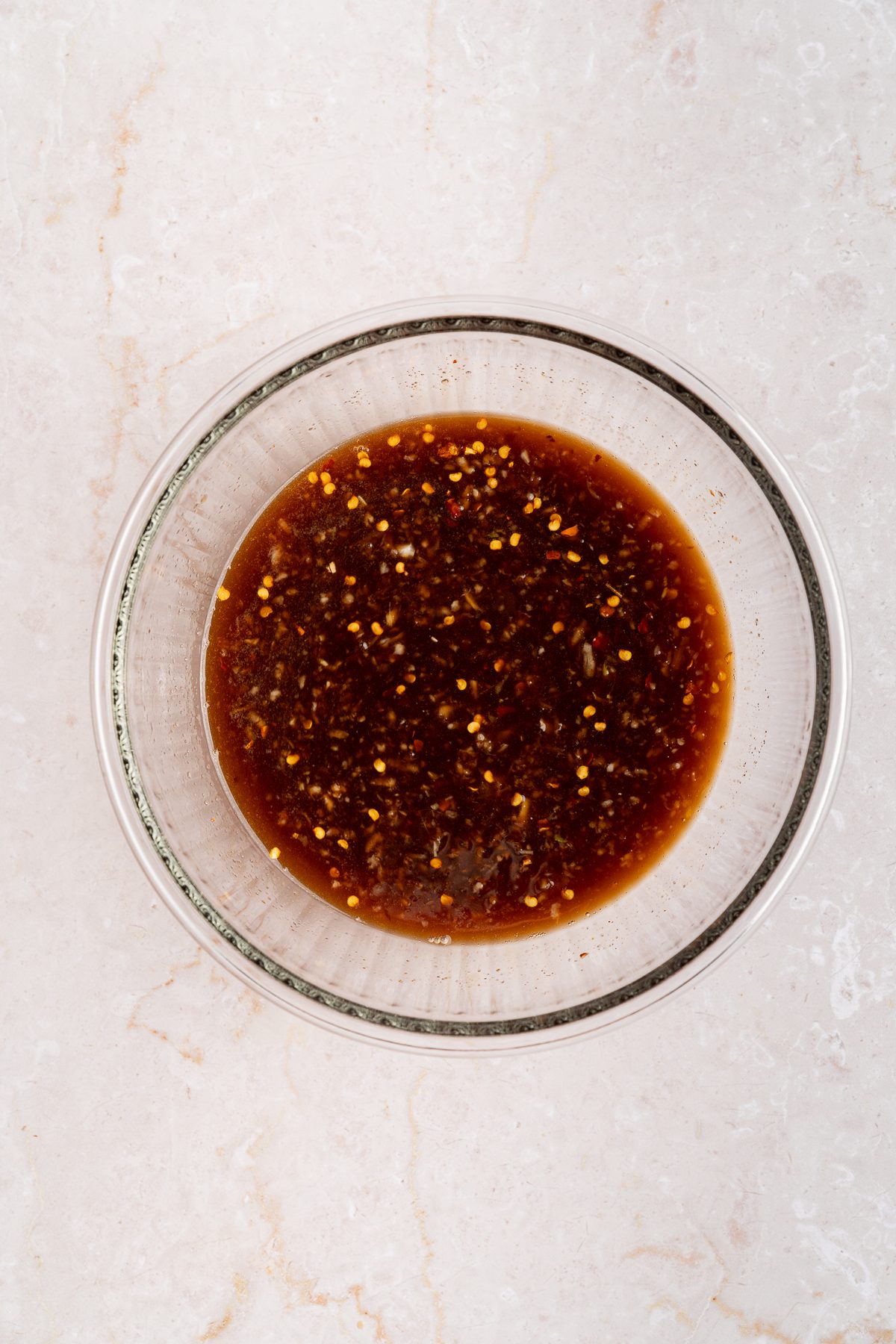 Whisked galbi sauce of soy sauce, hoisin, brown sugar, rice wine vinegar, garlic and ginger in a glass bowl